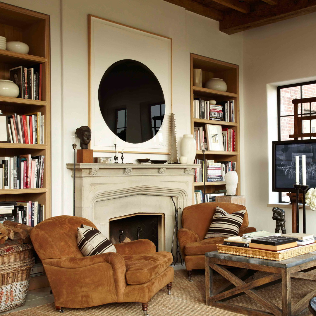 a living room filled with furniture and a fire place