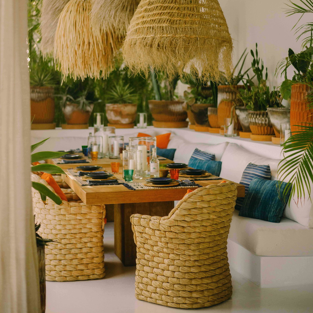 a dining room with a table and chairs