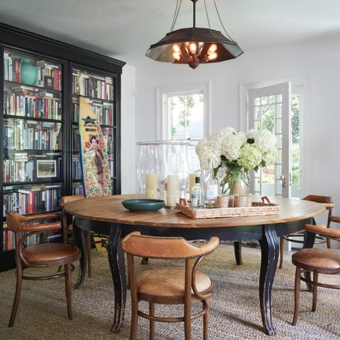 a dining room with a table and chairs