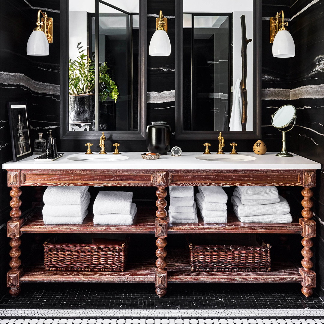 a black and white bathroom with a double sink