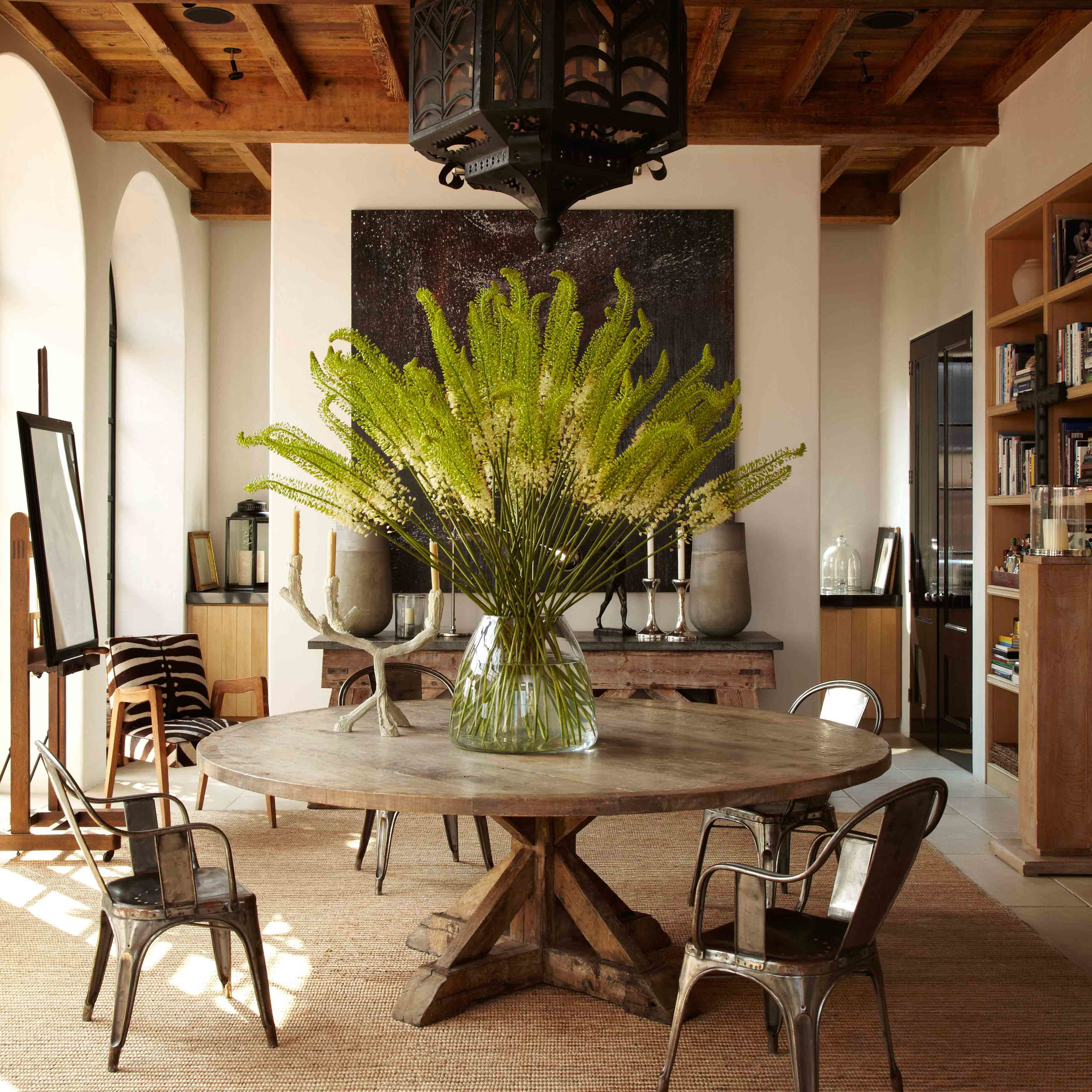 a dining room with a table and chairs