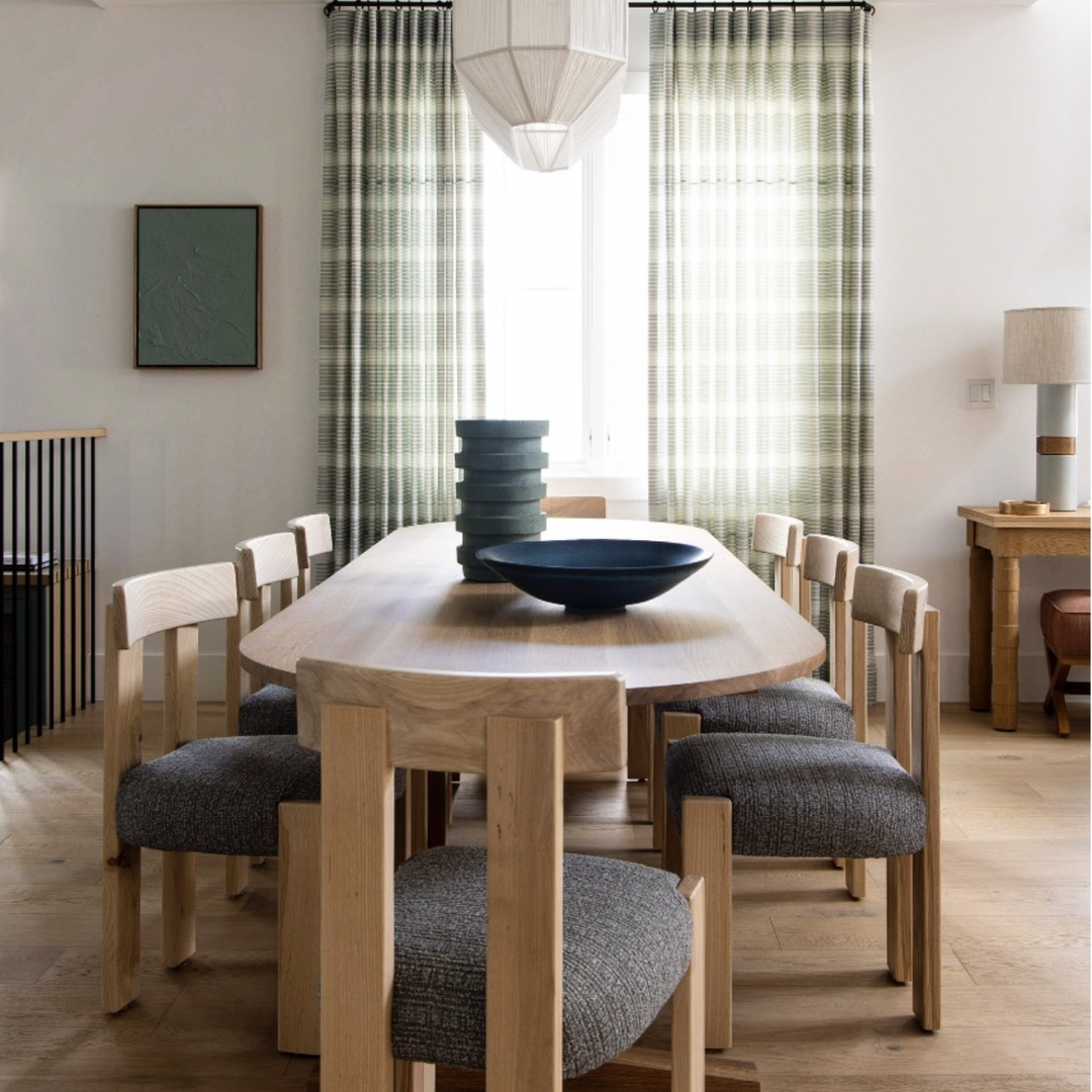 a dining room table with a bowl on top of it