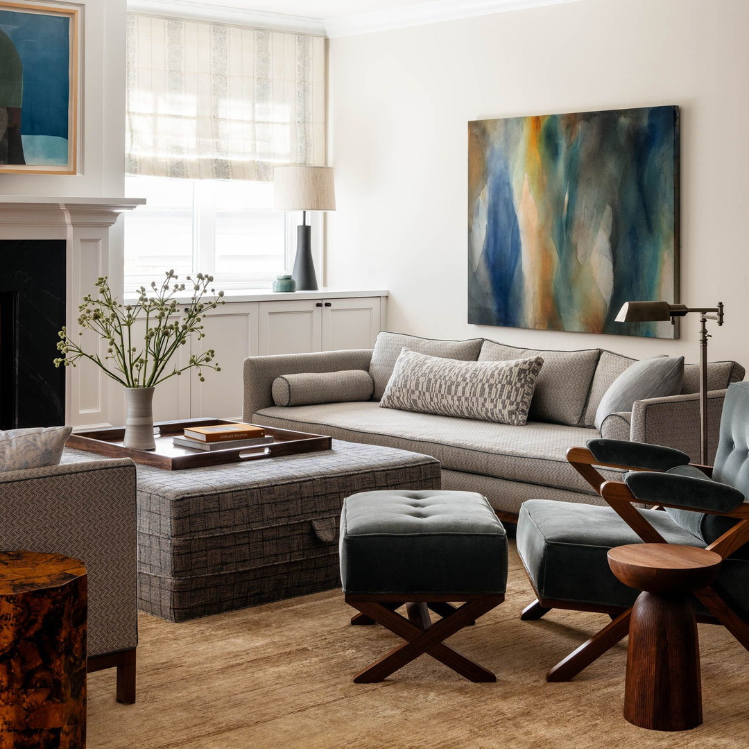 a living room filled with furniture and a fire place