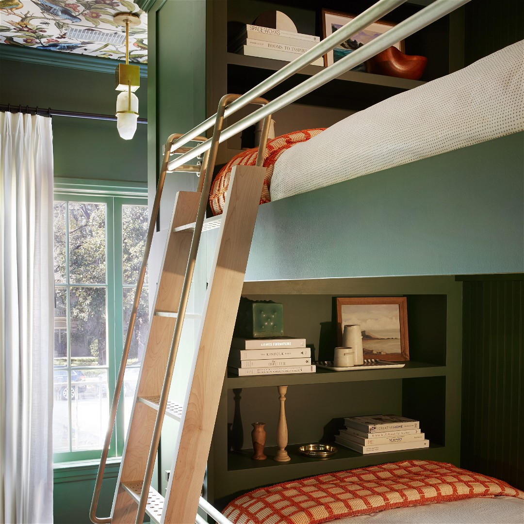 a bunk bed with a ladder to the top of it