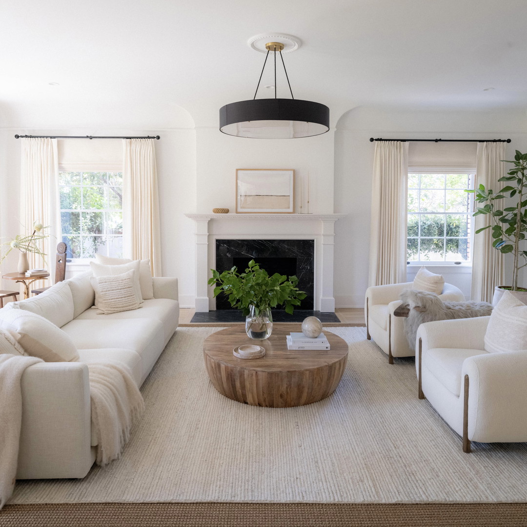 a living room filled with furniture and a fire place