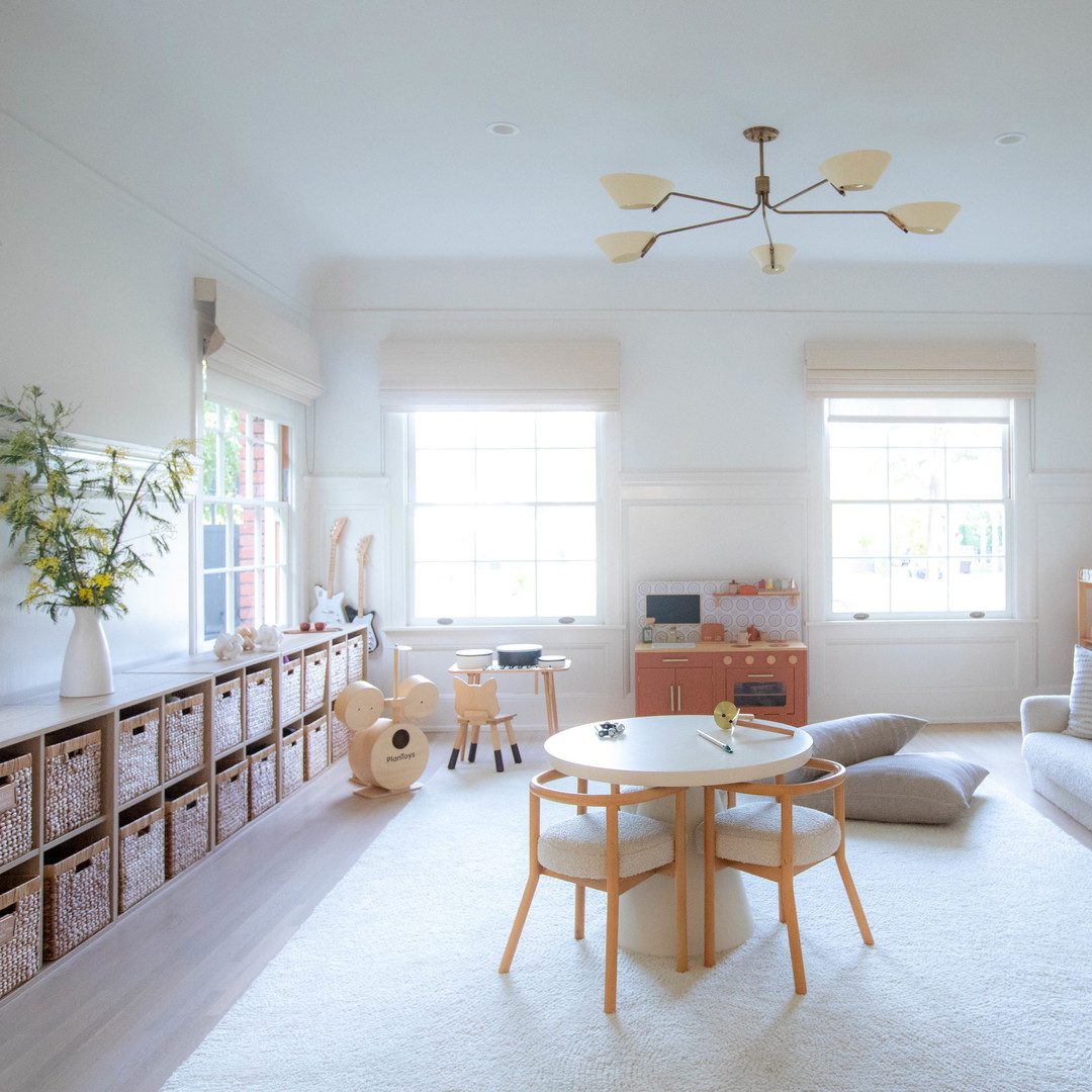 a living room filled with furniture and a white rug