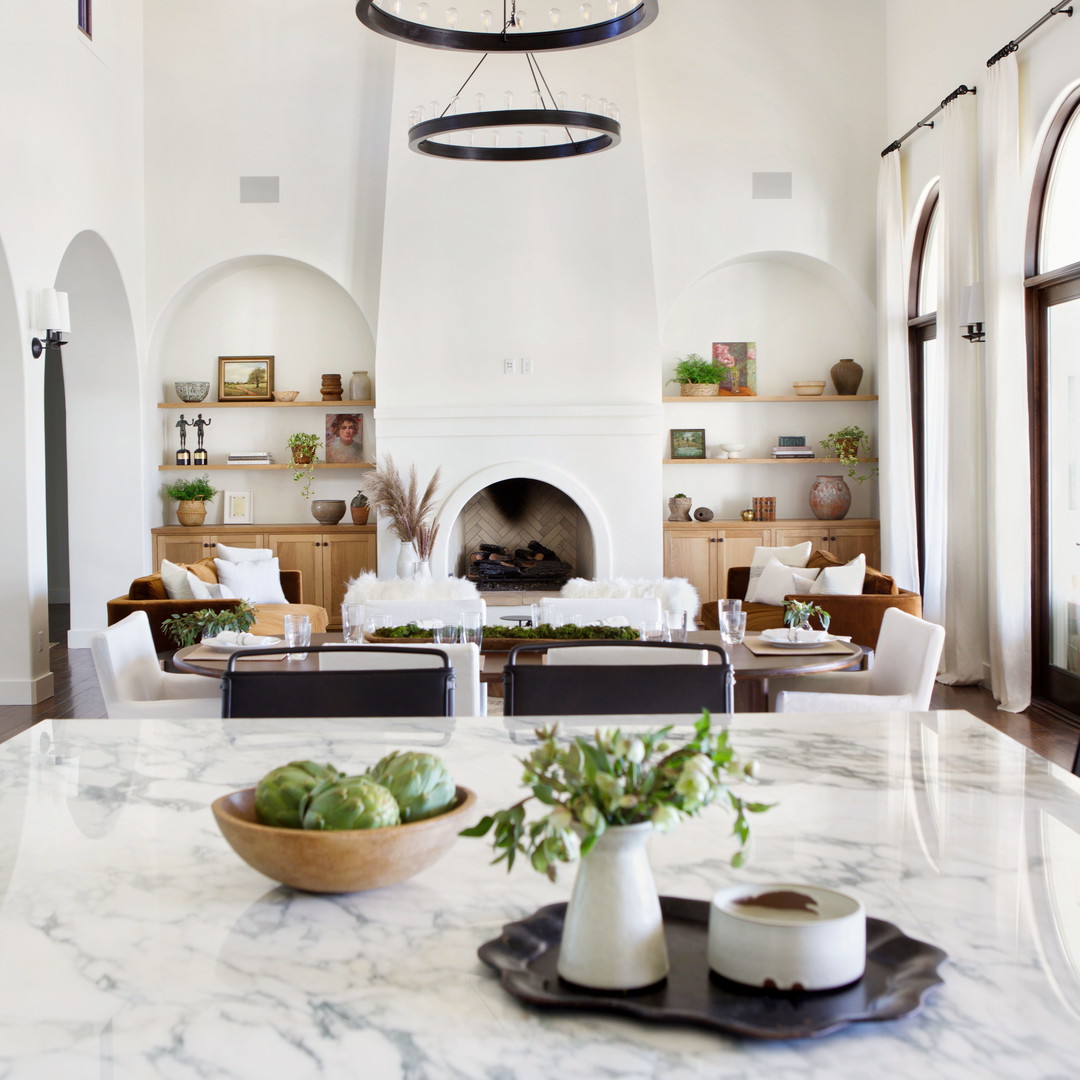 a large kitchen with a marble counter top