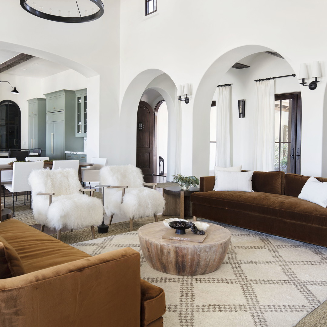 a living room filled with furniture and white walls