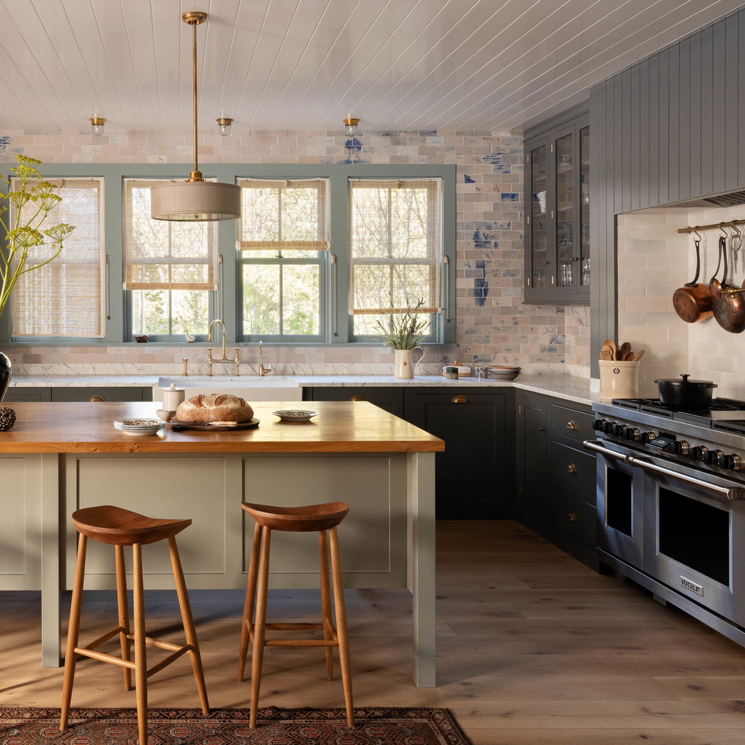 a kitchen with a center island with stools