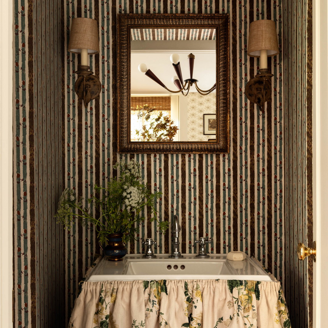 a sink and mirror in a small room