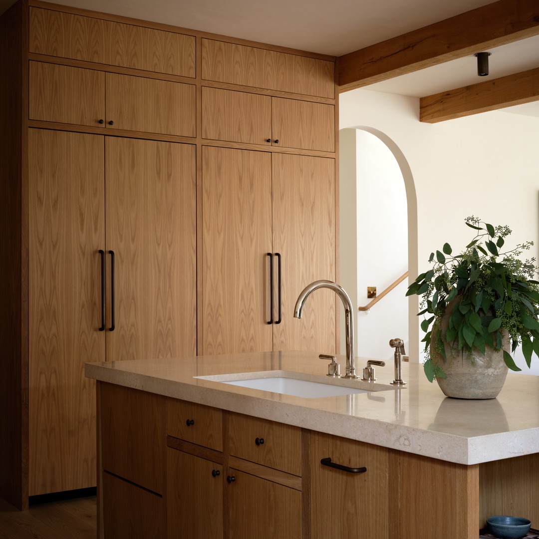 a kitchen with a sink and wooden cabinets