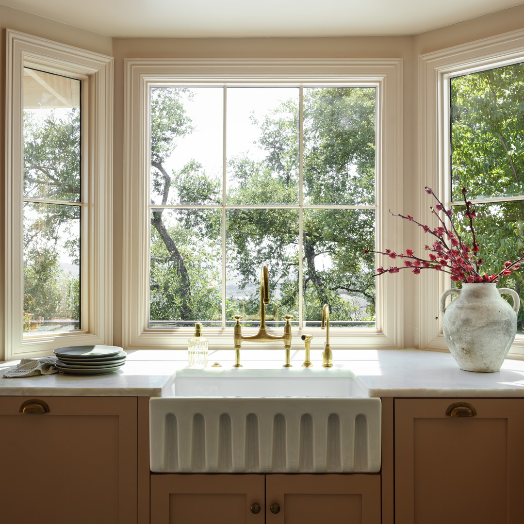a kitchen with a sink and a window