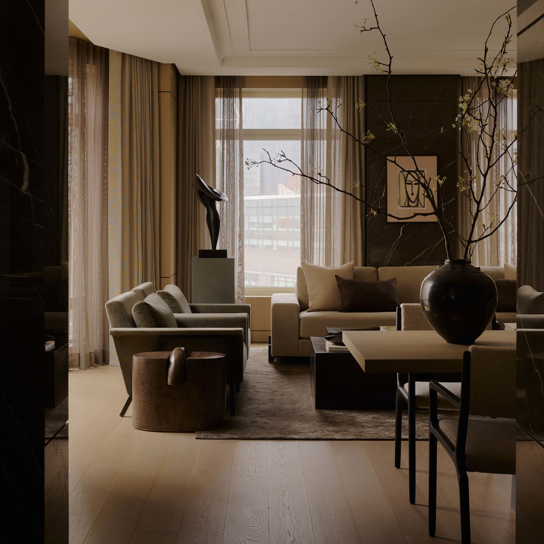a living room filled with furniture and a large window