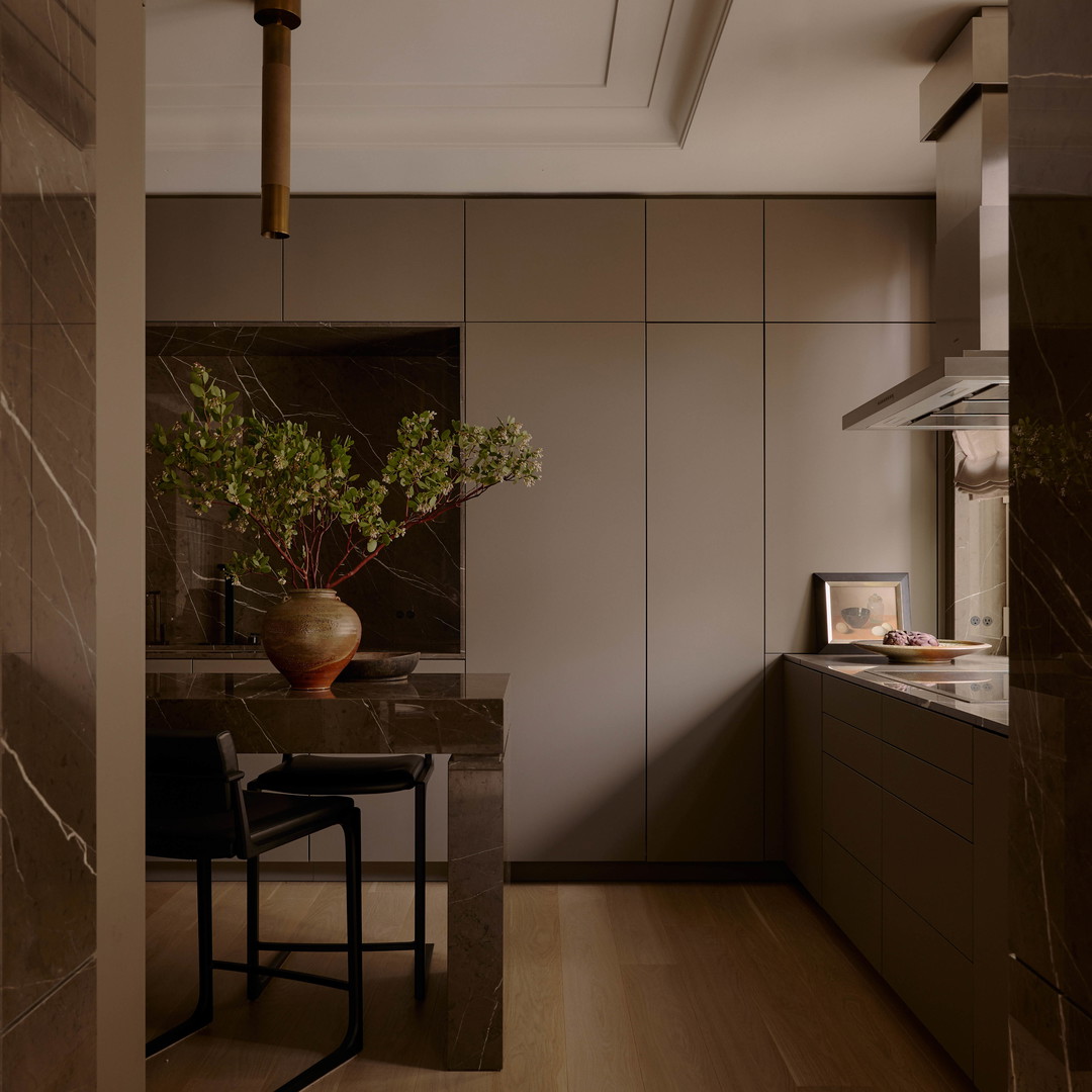 a vase with a plant on a table in a room