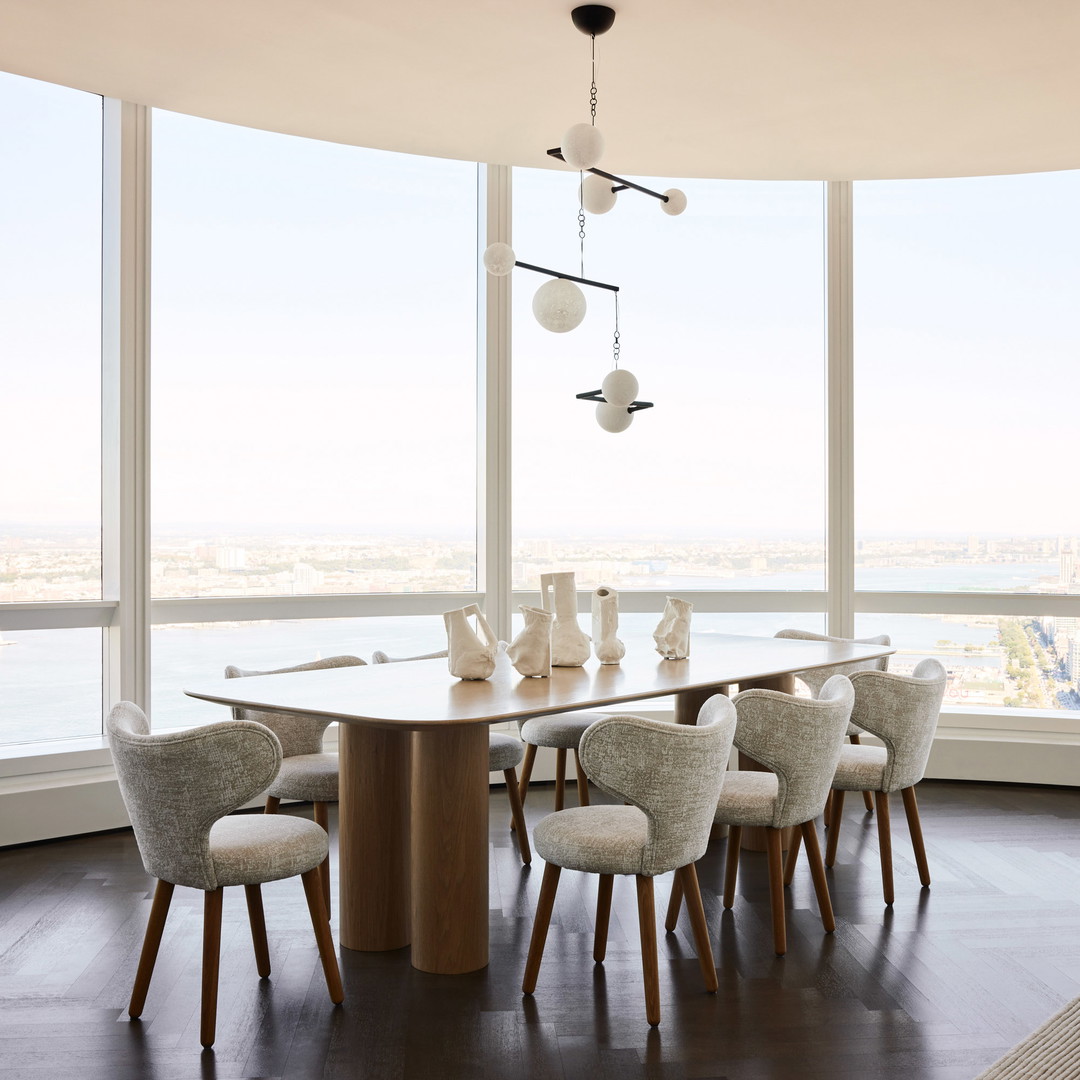 a dining room with a table and chairs