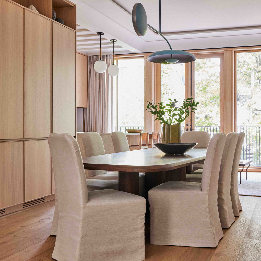 a dining room with a table and chairs