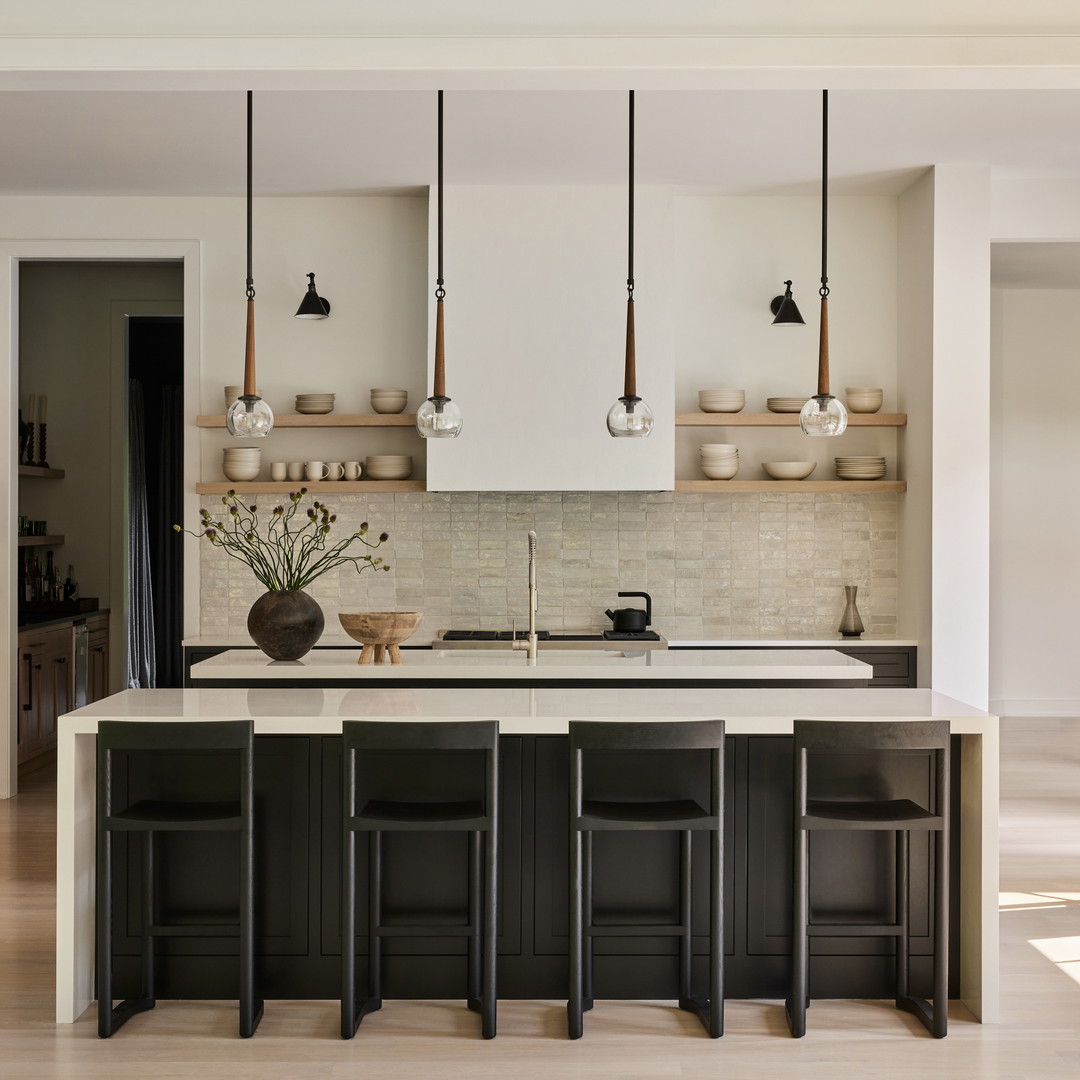 a large kitchen with a center island and wooden cabinets