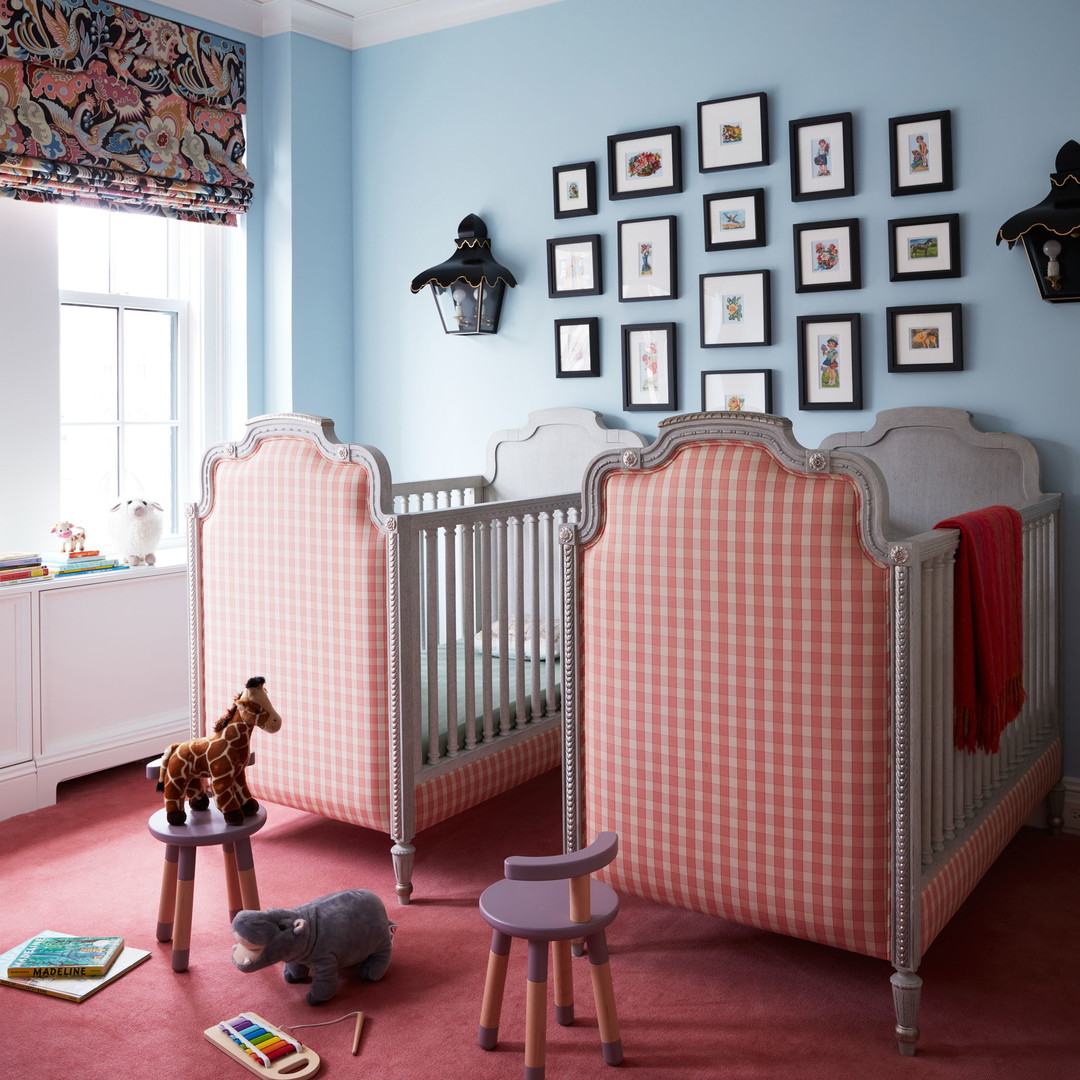 a baby's room with two cribs, a rocking horse, and