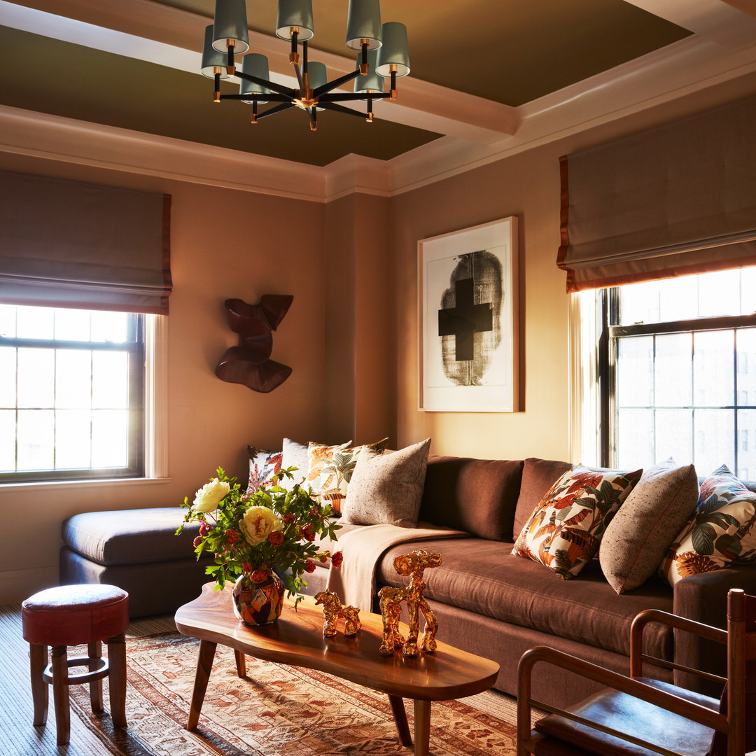 a living room filled with furniture and a chandelier