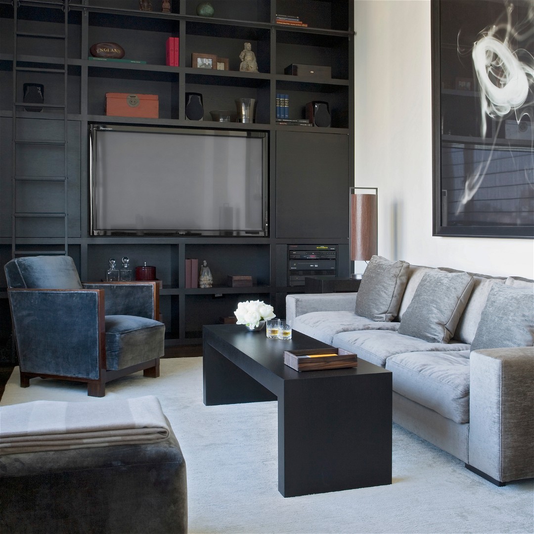 a living room filled with furniture and a flat screen tv