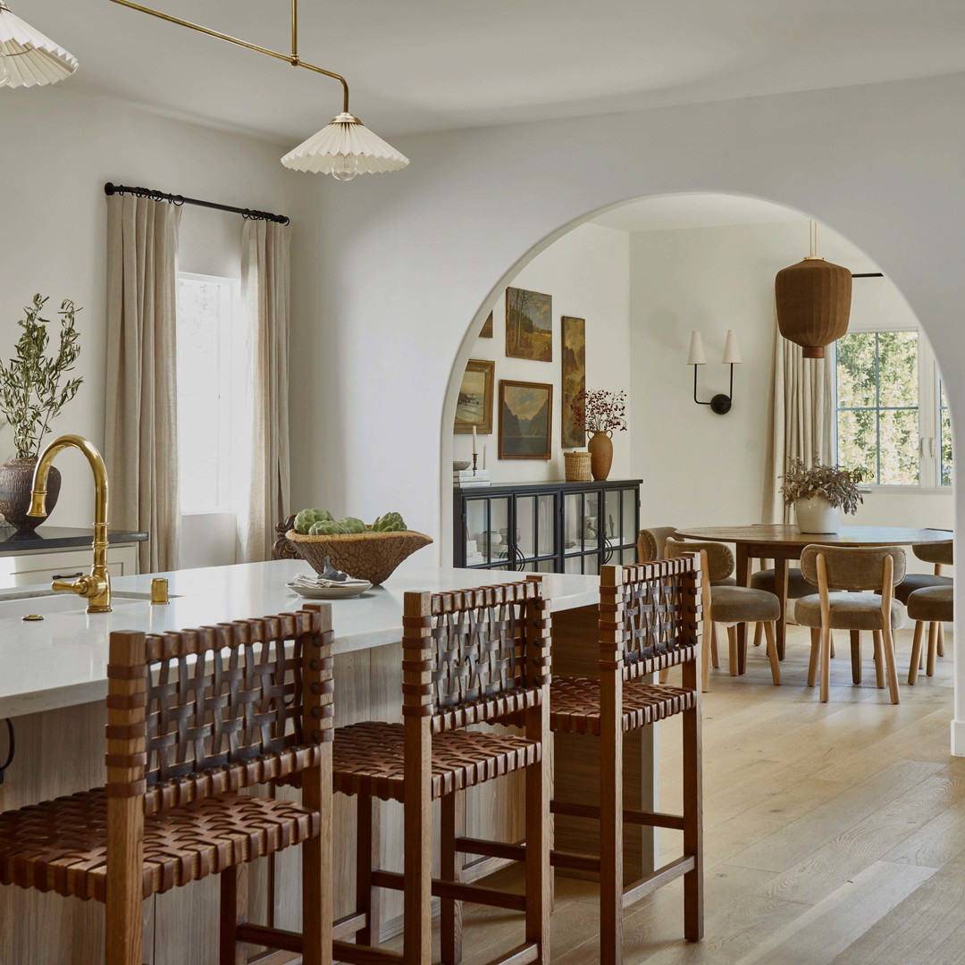 a dining room with a table and chairs