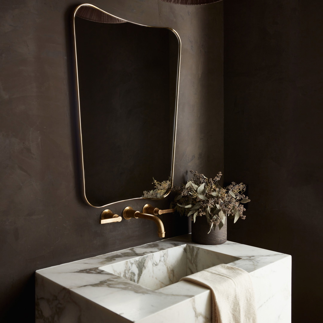 a bathroom sink with a large mirror above it