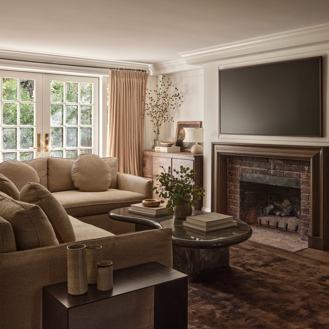 a living room filled with furniture and a fire place