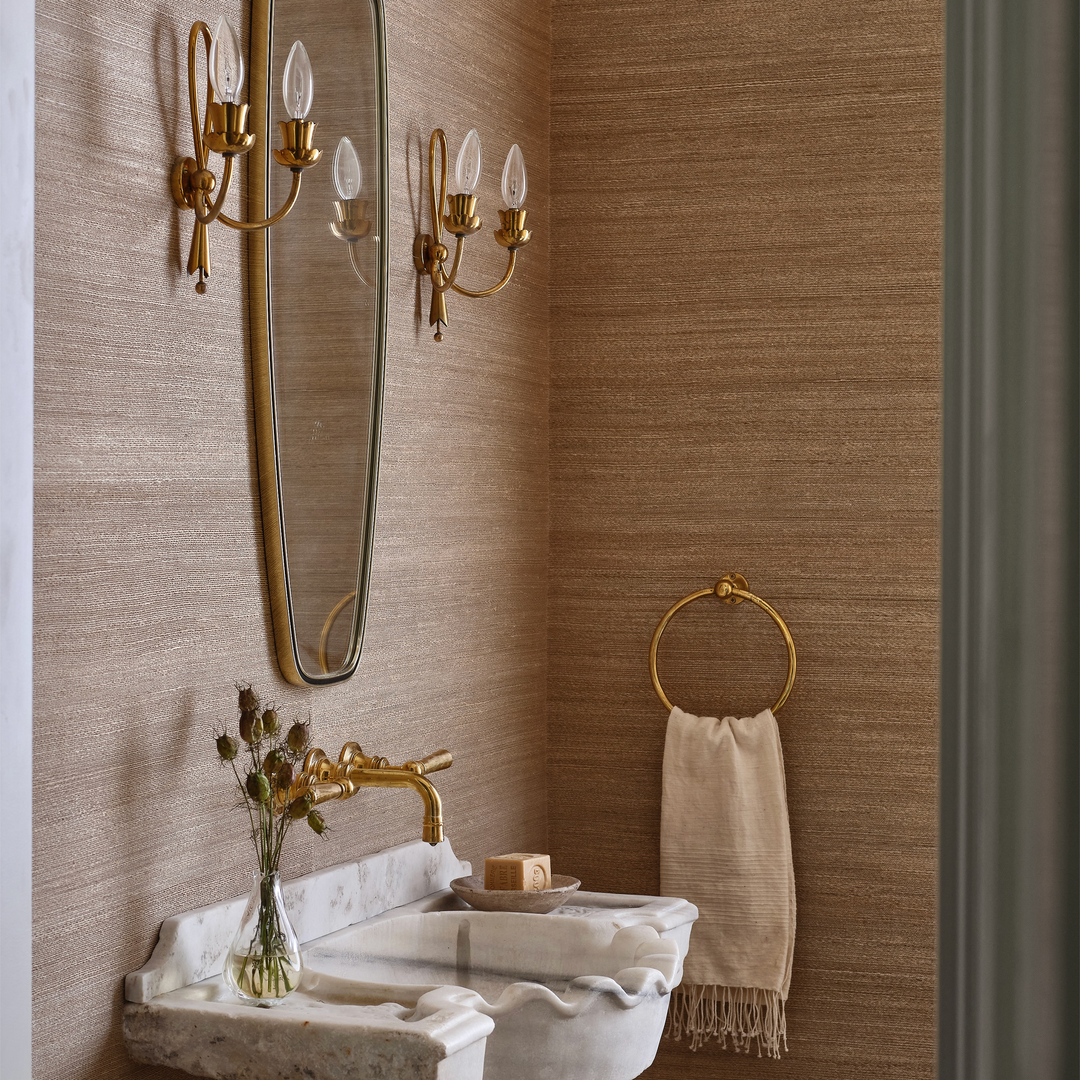 a bathroom with a sink, mirror and towel rack