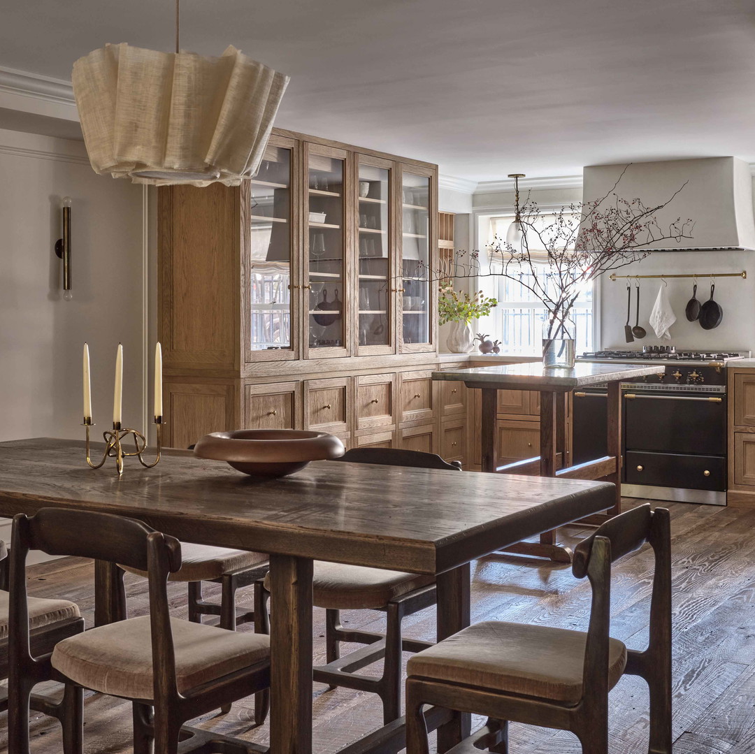 a kitchen with a table and chairs in it