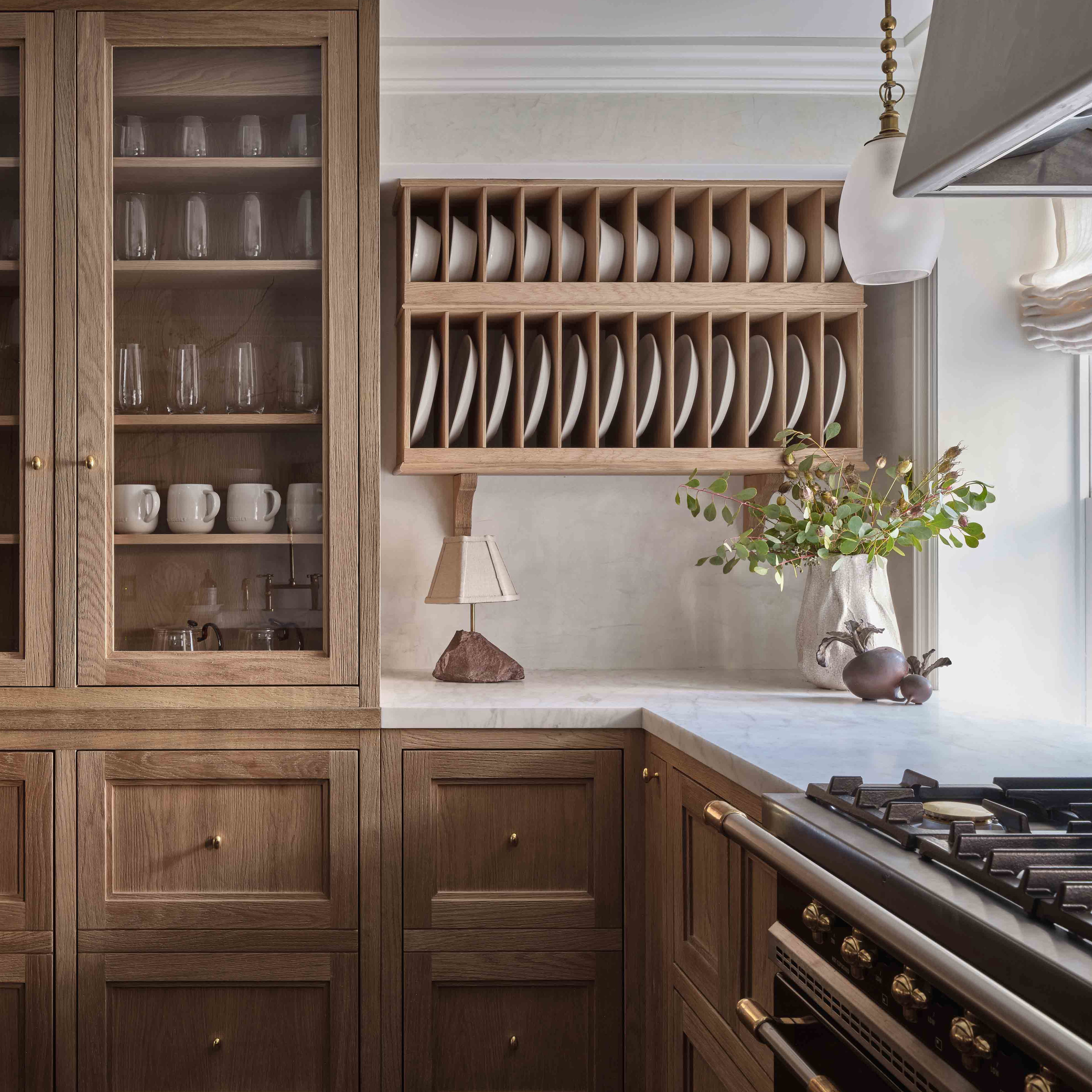 a kitchen filled with lots of wooden cabinets