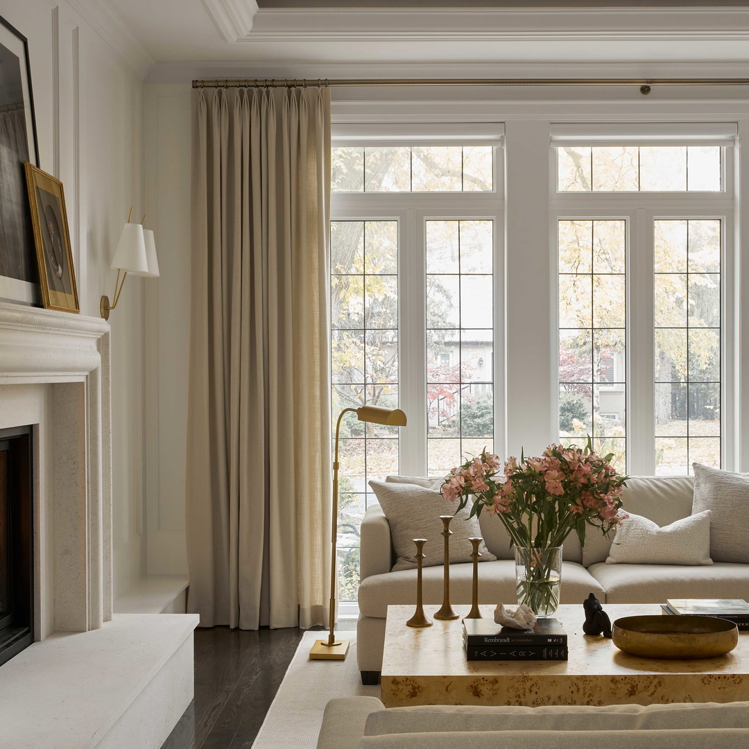 a living room filled with furniture and a fire place