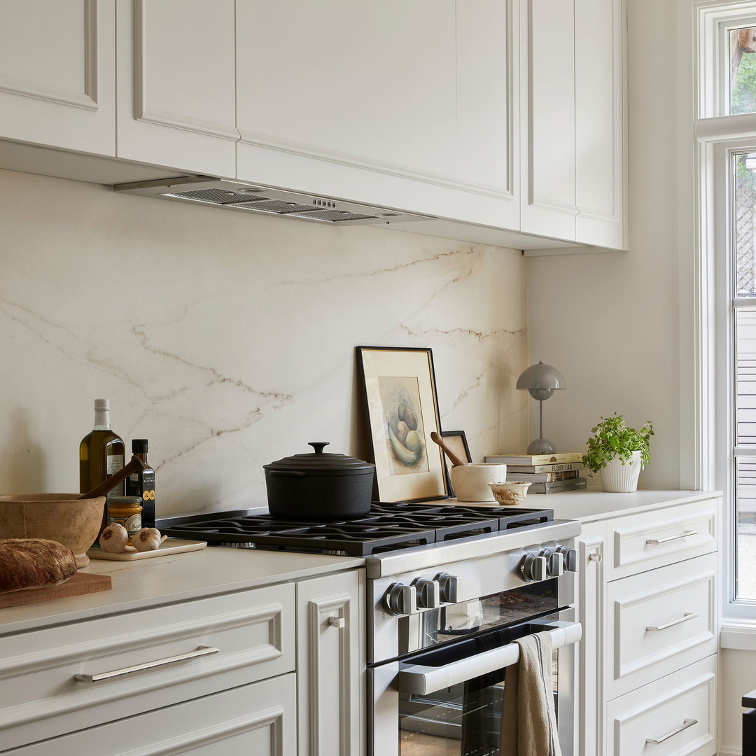 a kitchen with a stove and a window