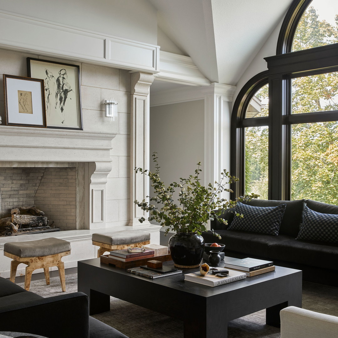 a living room filled with furniture and a fire place