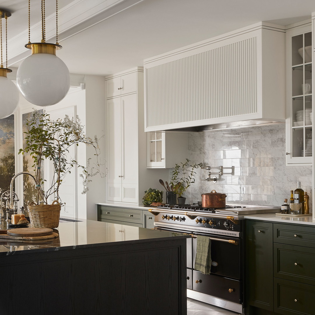 a kitchen with a stove top oven and a potted plant