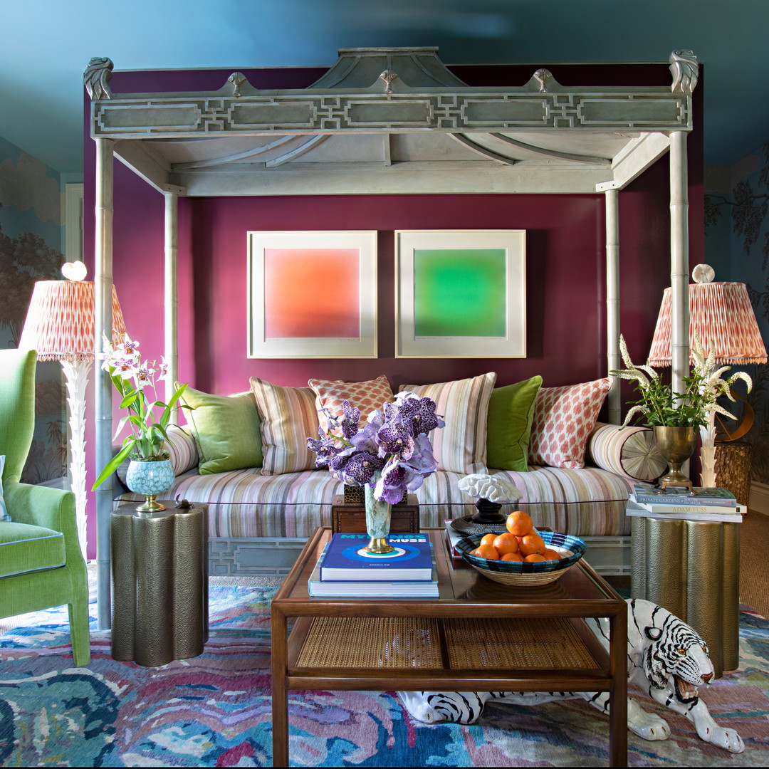 a living room filled with furniture and a canopy bed