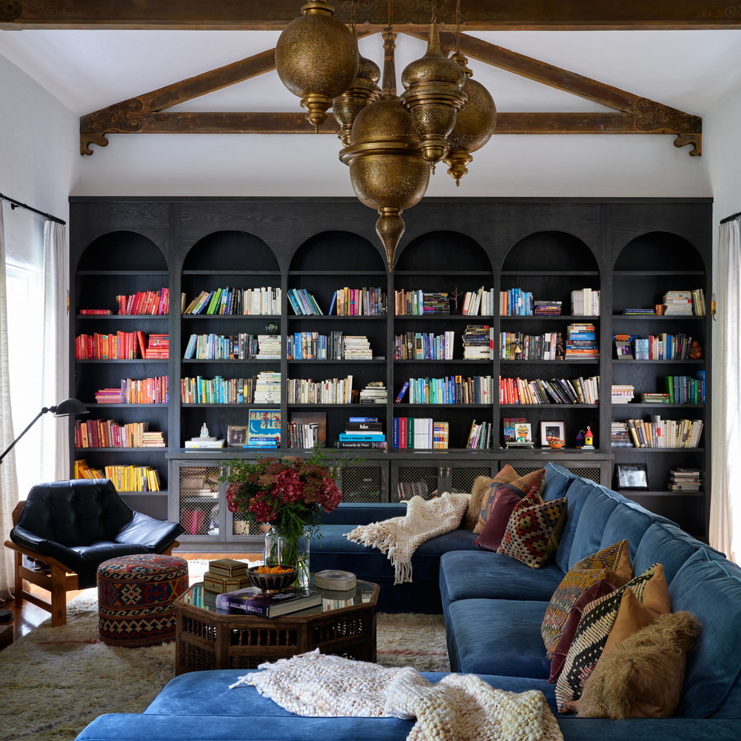 a living room filled with furniture and a fire place