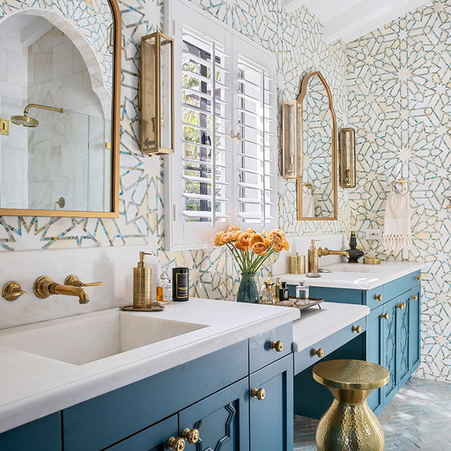 a bathroom with two sinks and a mirror