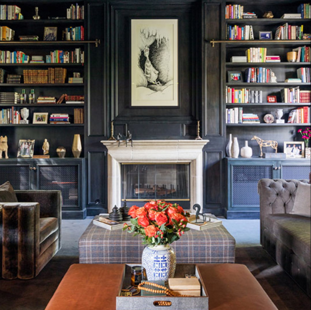 a living room filled with furniture and a fire place