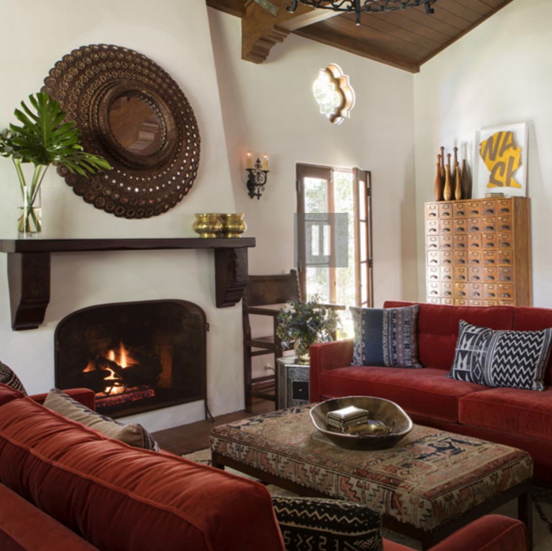 a living room filled with furniture and a fire place