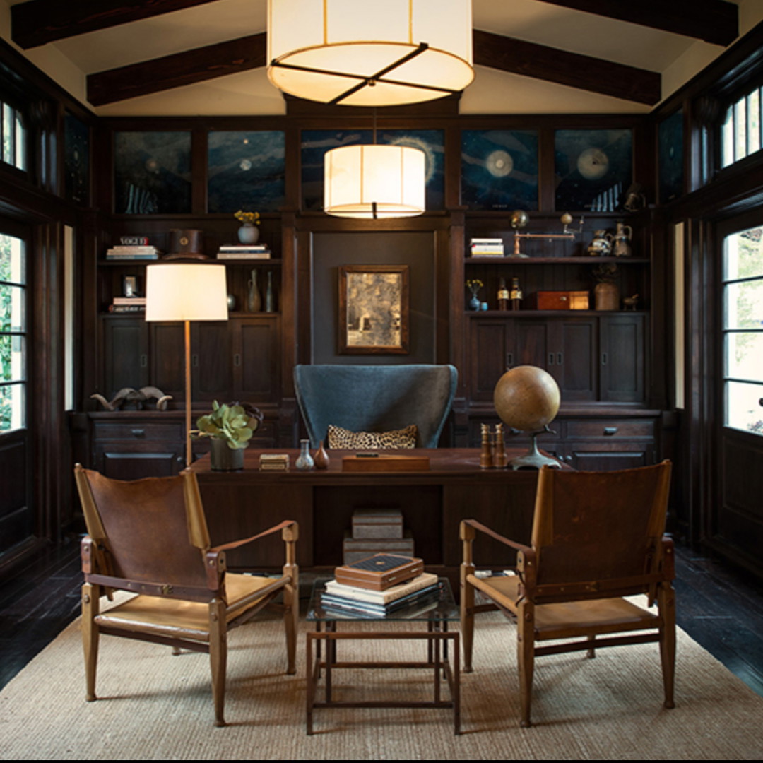 a home office with two chairs and a desk