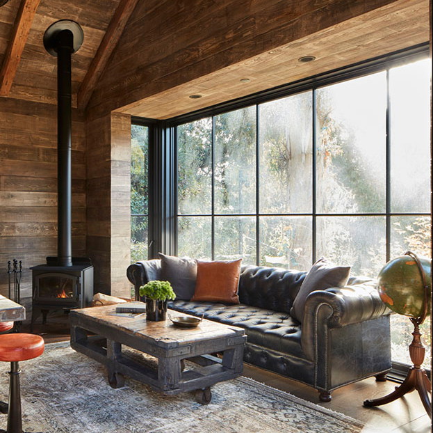 a living room filled with furniture and a fire place