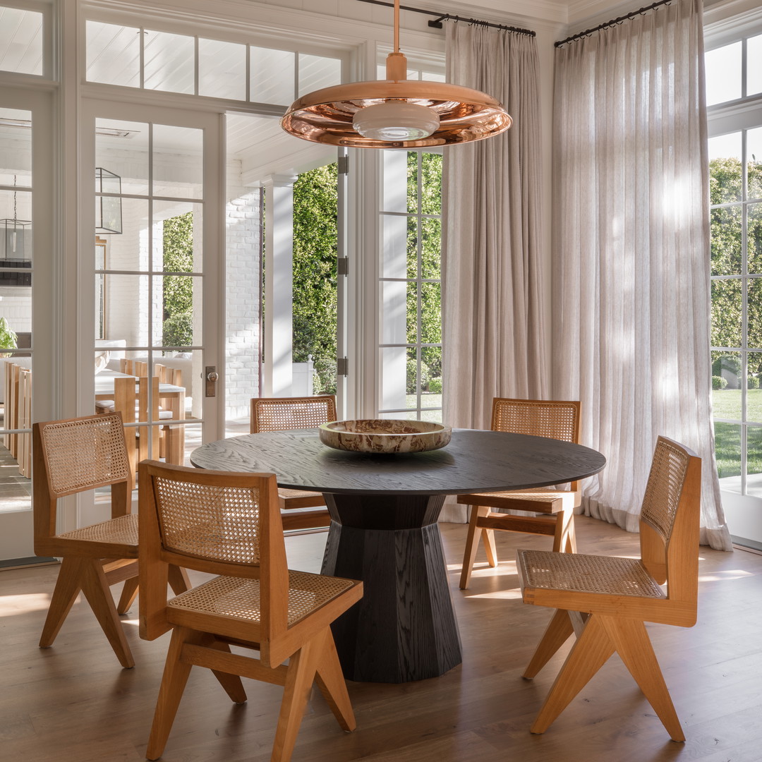 a dining room with a table and chairs