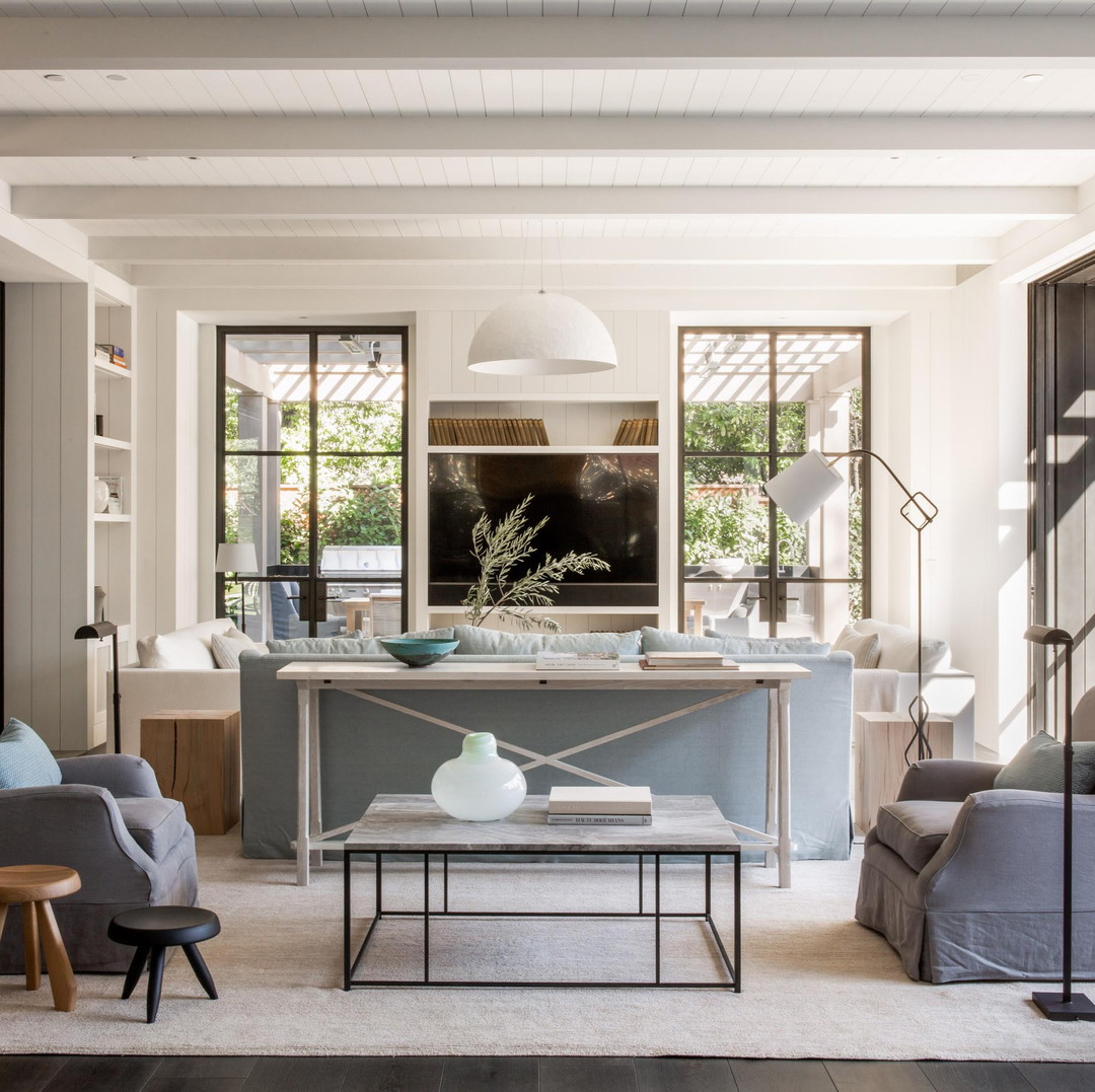 a living room filled with furniture and a flat screen tv