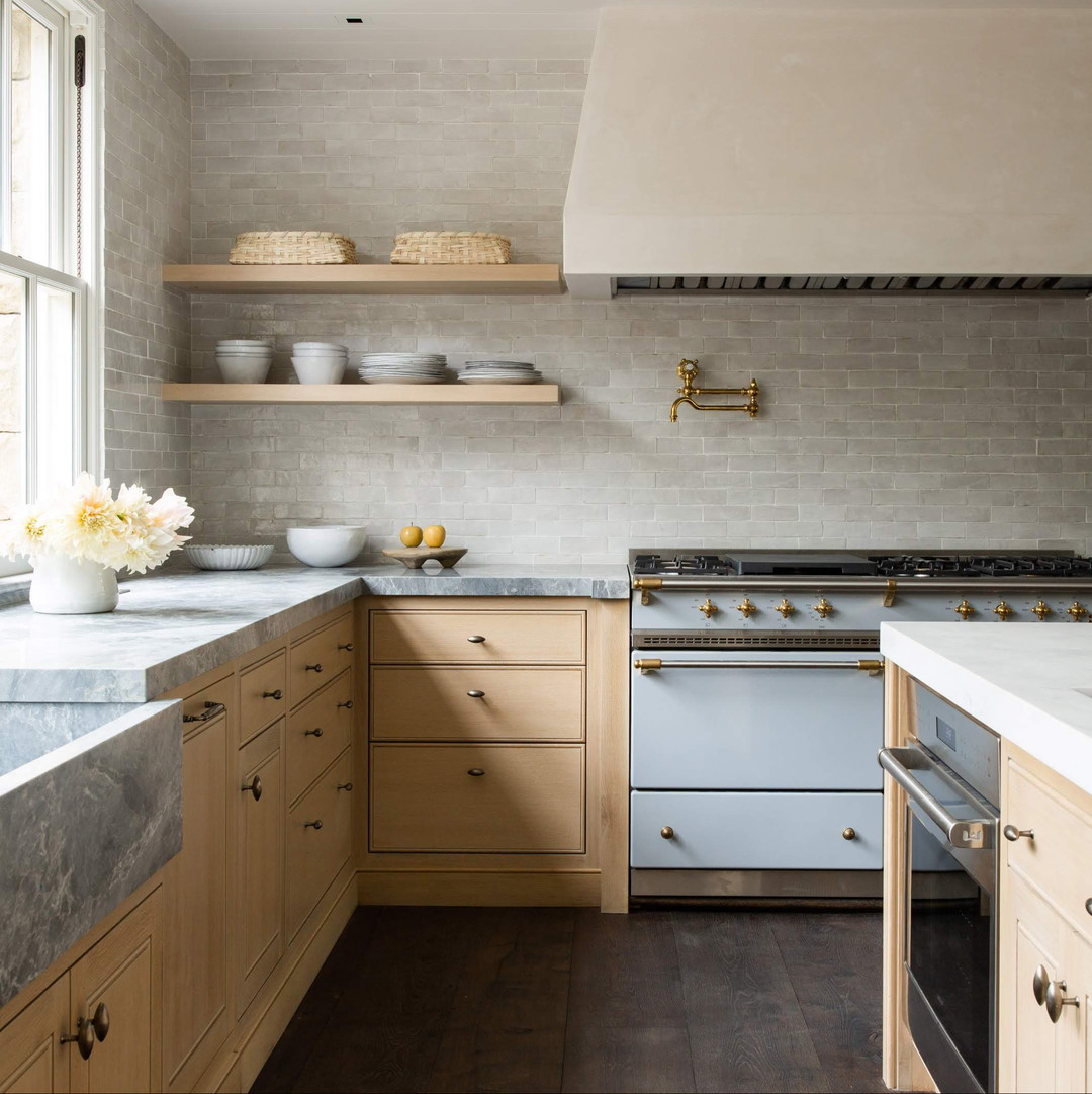 a kitchen with a stove top oven and a sink