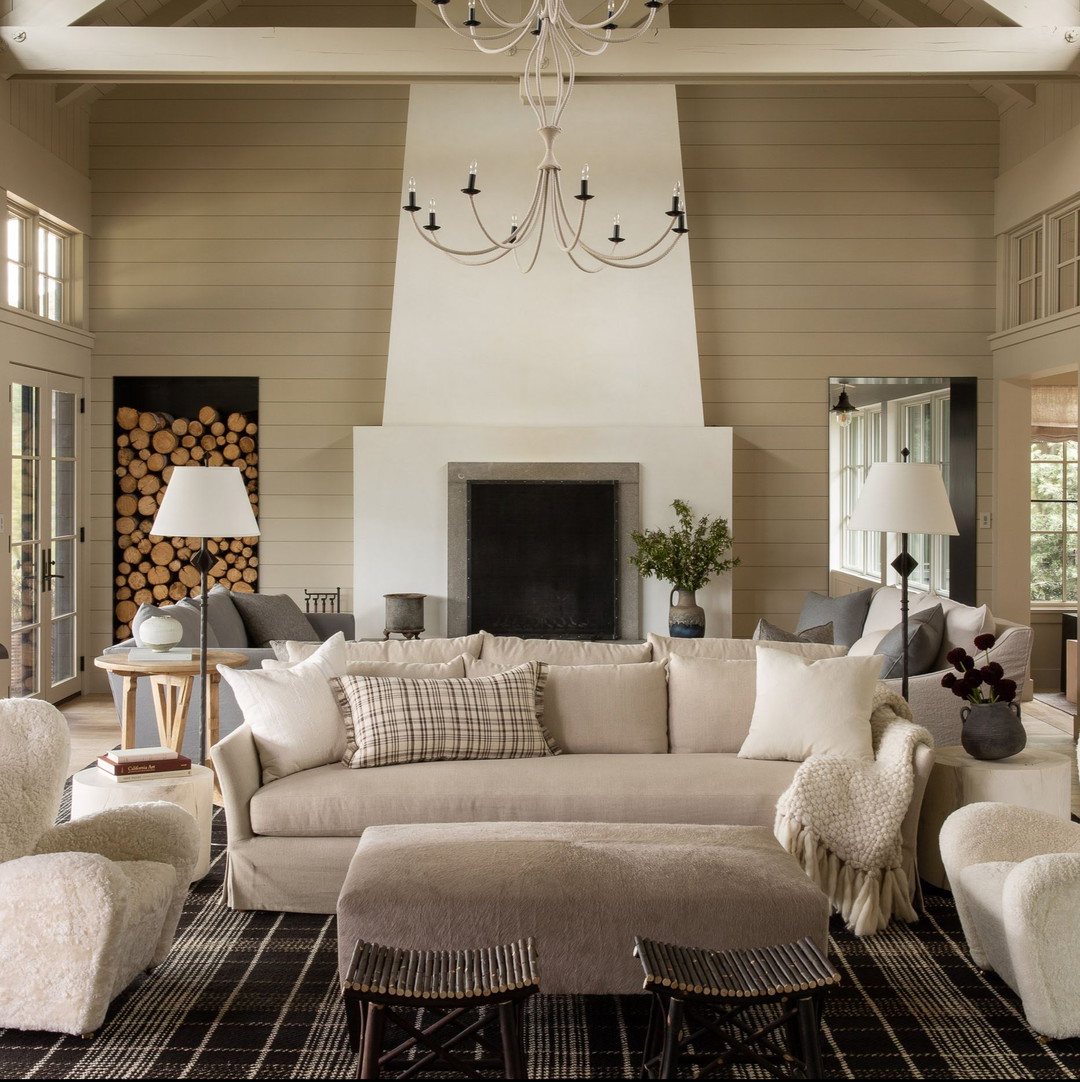 a living room filled with furniture and a fire place