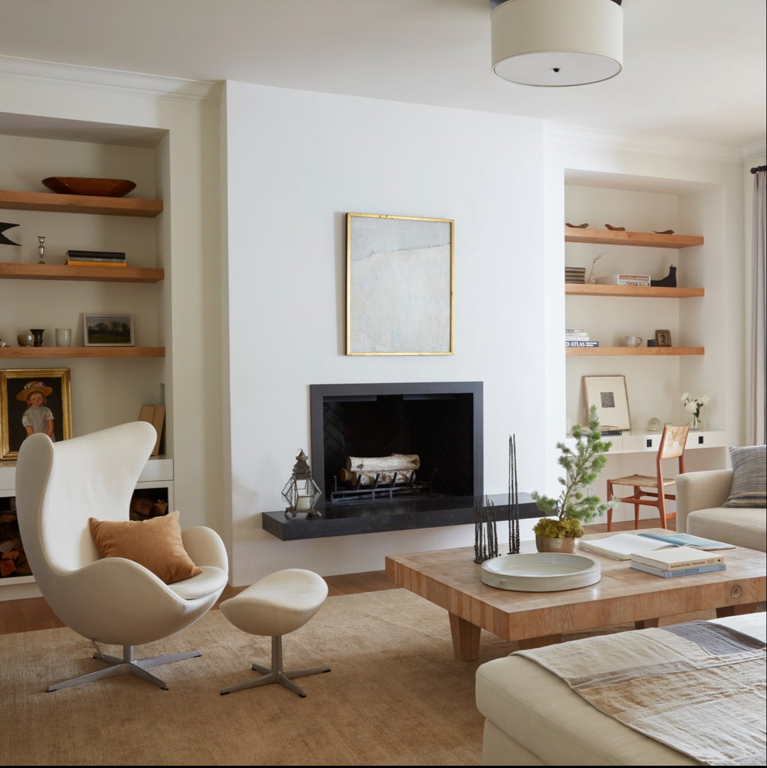 a living room filled with furniture and a fire place