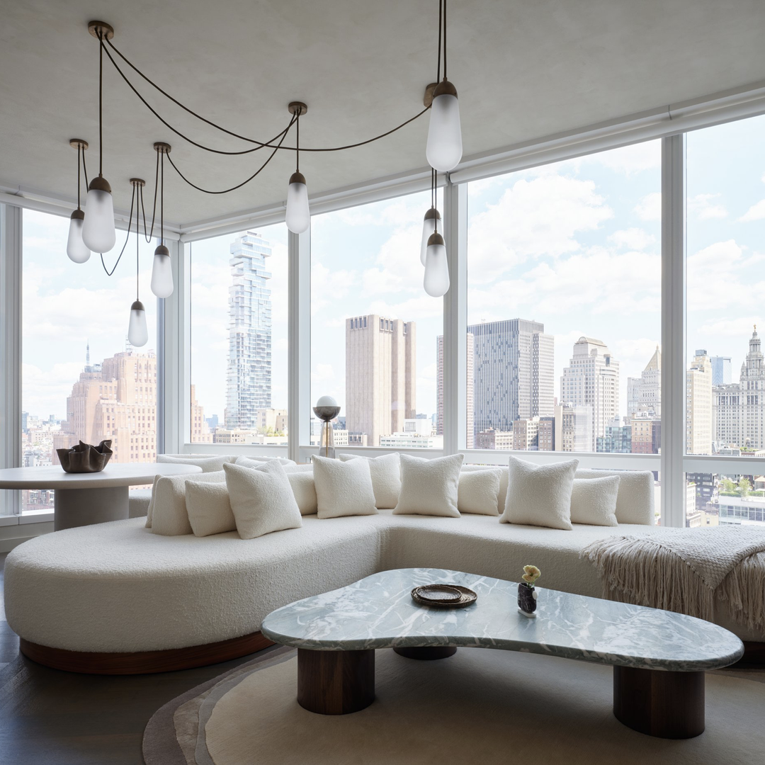 a living room filled with furniture and a large window