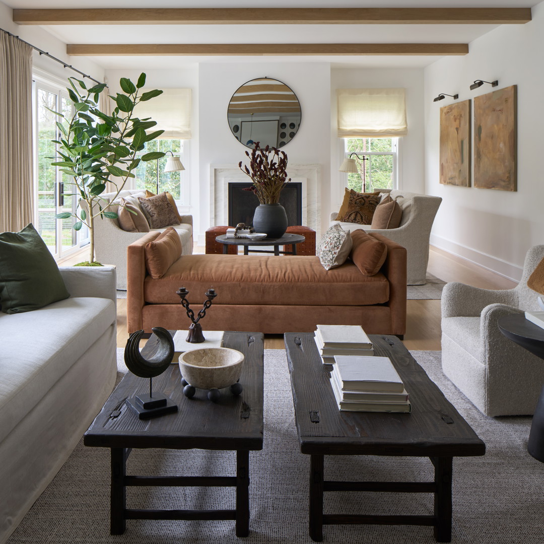 a living room filled with furniture and a fire place