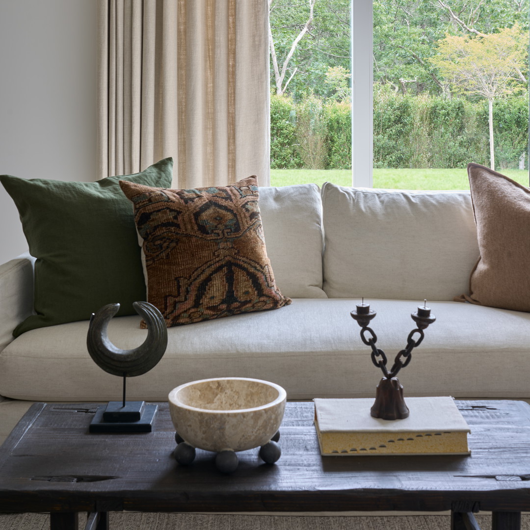 a living room with a couch and a table