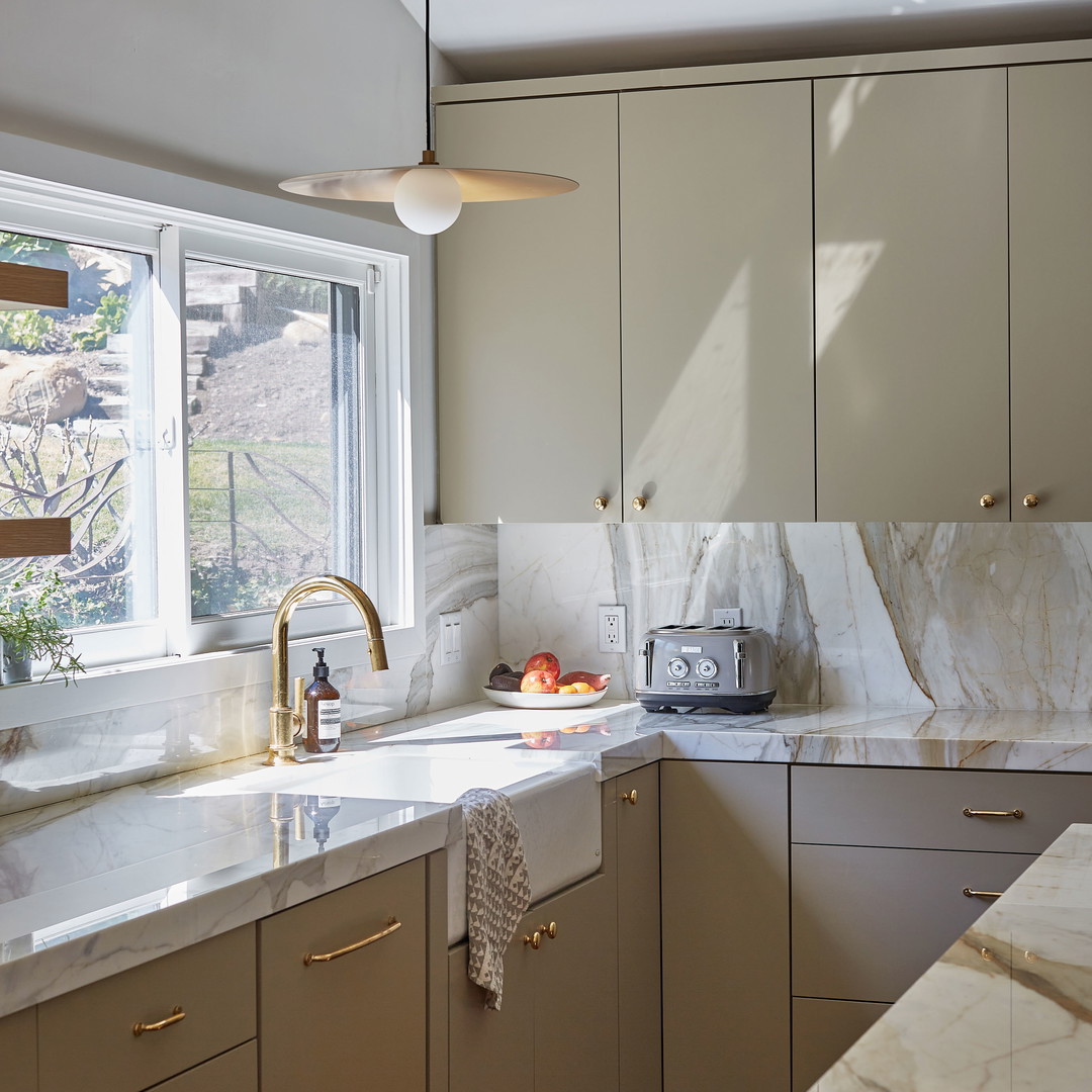 a kitchen with a sink and a window